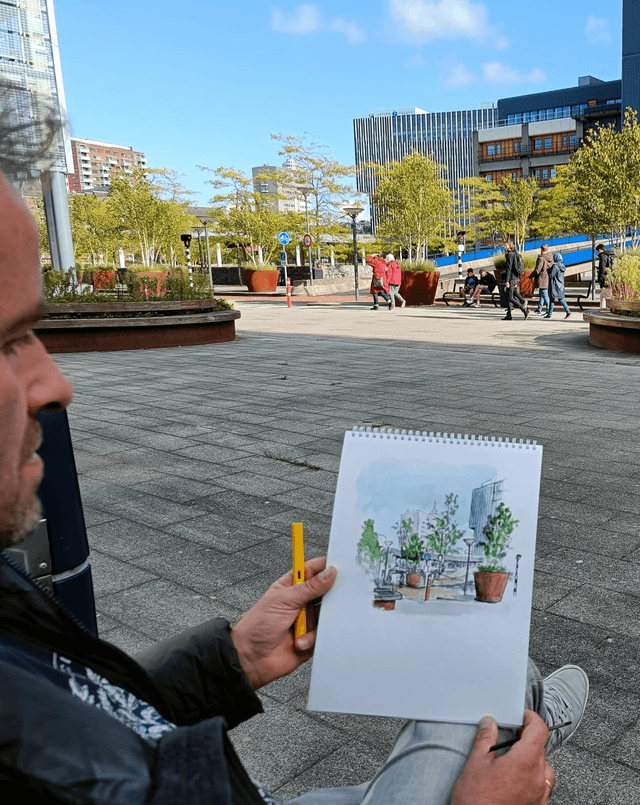 Jaap van der Meij aan het tekenen